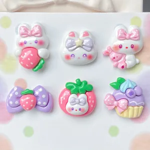Resin cute rabbit strawberry bow cake cabochons close up shot for DIY craft accessories detail