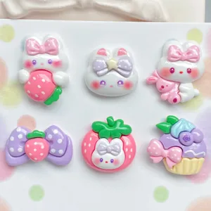 Cute resin bunny and strawberry charms detail, perfect for DIY handmade crafts and accessories.