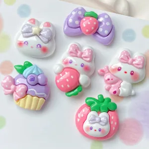 Cute glossy kawaii resin cabochons featuring cartoon bunnies, strawberries, and bows for DIY crafts.