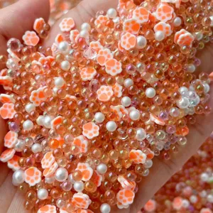 Mixed clay cat paw beads and bubble beads for DIY handmade slime craft accessories and jewelry making.