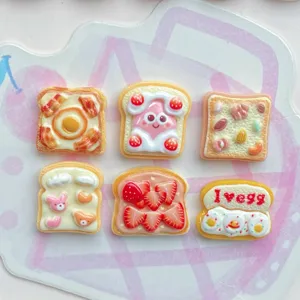 Cute resin toast food play charms details, sweet strawberry and egg designs for DIY crafts.