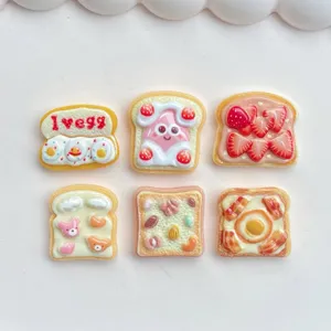 Cute strawberry egg toast resin flatbacks charms, perfect for DIY phone cases and hair clips.
