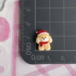 Christmas resin dog cabochon with Santa hat and scarf for DIY hair clips and jewelry making.
