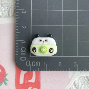 Resin panda camera charm detail view, cute miniature diy accessory for jewelry crafting.