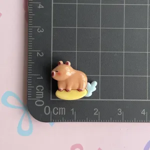 Cute cartoon capybara resin flatback charm for DIY phone case hair clip crafting.