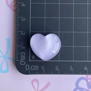 Purple glitter heart resin charm detail, cute DIY accessory for phone cases and hairpins.