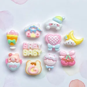 Close-up of colorful resin charms, cute cartoon animal and shape cabochons for DIY crafts.
