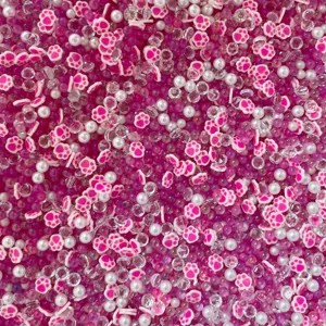 Clay paw beads DIY slime charms and pearl rhinestone mix craft accessories detail shot.