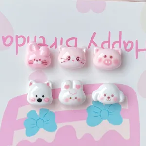 Close-up detail of cute miniature resin animal charms, perfect for DIY nail art and hair accessories.