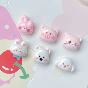 Close-up detail of cute cartoon animal resin cabochons, perfect for DIY nail art and hair clips.