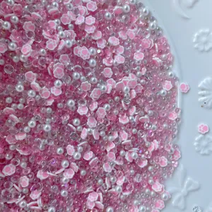 DIY pink cat paw polymer clay beads mixed with white pearls and sparkling clear rhinestones.