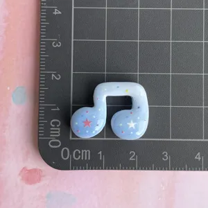 Resin music note charm with colorful stars for DIY hair clips, phone cases, and stationery.