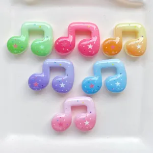 Colorful resin music note charms detail shot, cute DIY star embellishments for crafts.