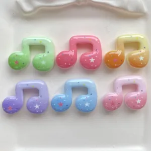 Colorful resin music note charms with star patterns for DIY phone cases and hair clips details.