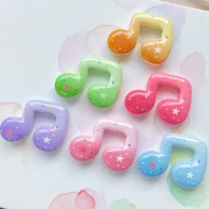 Colorful resin musical note charms with glitter stars, perfect for phone cases and DIY crafts.