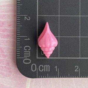 Mini pink resin conch shell charm detail view, ideal for DIY phone case and crafts decor.