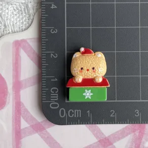 Detailed view of Christmas cartoon resin cabochon charm for DIY hair clips crafting.