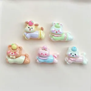 Detailed close-up of cute mini cartoon animal resin charms for DIY phone cases and hair clips.