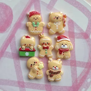 Detail view of cute Christmas gingerbread man and cartoon resin flatback charms for DIY hair clips.