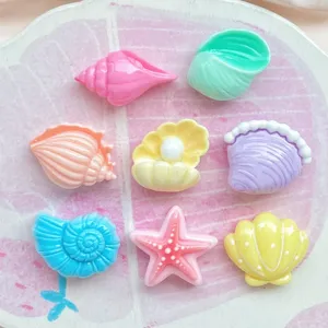 Mini colorful resin seashell and starfish cabochons for DIY phone case and hairpin decor.