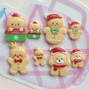 Details showing cute Christmas gingerbread man and animal resin charms, perfect for DIY hair clips.