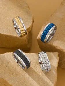 Detail view of rotatable watch chain rings in various metallic finishes