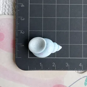 Resin seashell charm detail, ocean theme miniature figurine for DIY crafts and accessories.