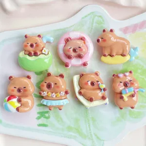 Cute cartoon capybara resin charms details, water play theme DIY accessories for phone cases.