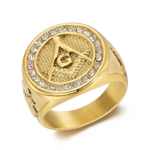 Macro view of gold stainless steel Freemasonry signet ring with sparkling rhinestones