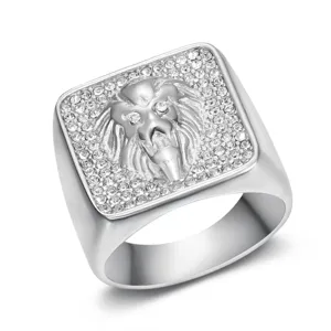 Macro view showing the detailed lion head engraving and crystal inlay on a men's ring