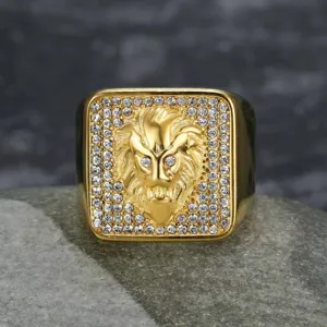 Detailed macro shot of a gold-plated stainless steel lion head ring with sparkling clear rhinestones