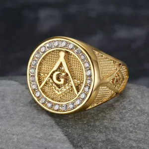 Detailed view of a gold Masonic ring for men with rhinestone border and 'G' symbol.