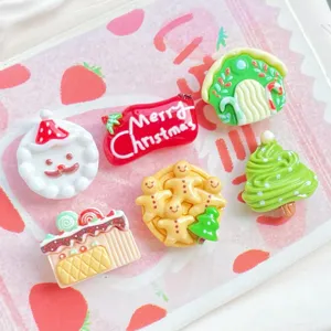 Christmas resin cabochons detail shot, cute snowman and tree charms for DIY crafts.
