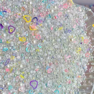 Mixed DIY resin rhinestones pearls and cute colorful heart star charms for crafts and slime decor.