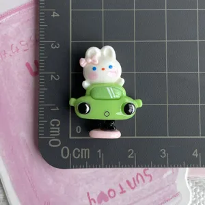 Close-up detail of a cute resin rabbit car charm, perfect for DIY phone cases and hair clips.