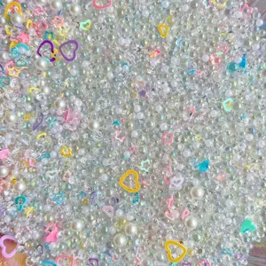 Mixed DIY craft beads, clear rhinestones, faux pearls, and colorful heart resin charms.