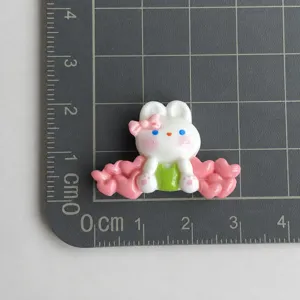 Cute resin rabbit DIY accessory with grid ruler sizing, perfect for phone cases and hair clips.