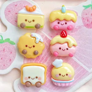 Close-up detail of cute cartoon cake and bread resin charms, perfect for DIY phone case decor.