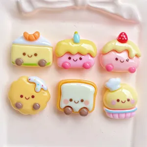 Cute resin food charms detail, smiling cake and bread cabochons for DIY phone case crafts.