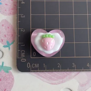 Resin strawberry heart cabochon detail, cute DIY phone case accessory and miniature craft item.