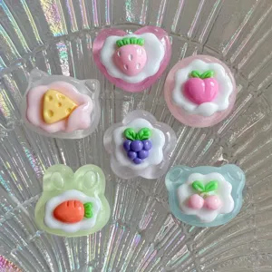 Cute glossy transparent fruit resin cabochons charms detail view for phone case DIY and crafts.