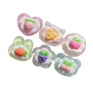 Glossy transparent resin fruit flatback charms for DIY phone case and craft decoration.