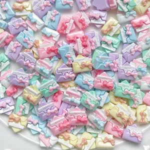 Mini resin envelope bow charms with love text, perfect for DIY nail art and phone case deco.