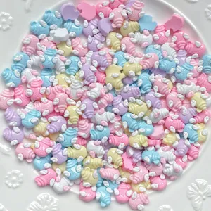 Close-up detail view of colorful mini resin wing charms for DIY nail art and jewelry crafts.