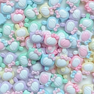 Cute mini resin cartoon cat bow charms close up detail shot for DIY nail art and jewelry making.