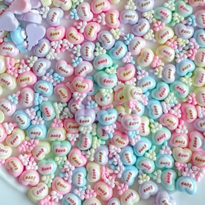 Cute mini resin heart candy charms with bow design, perfect for DIY nail art and ear stud crafts.