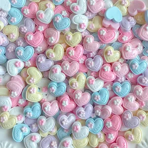 Cute mini heart resin charms with flower and love text, perfect for DIY nail art and jewelry.