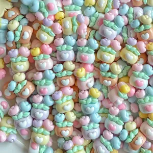 Detailed view of colorful resin potted plant charms, cute DIY miniature accessories for nail art.