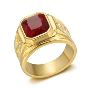 Detailed view of a gold men's dragon ring featuring a square red gemstone inlay