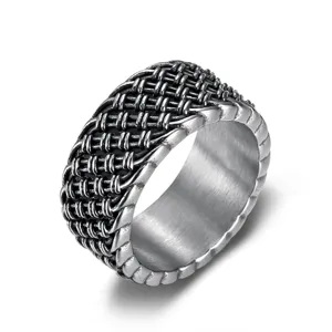 Close-up detail of the woven texture and distressed finish on a vintage stainless steel ring